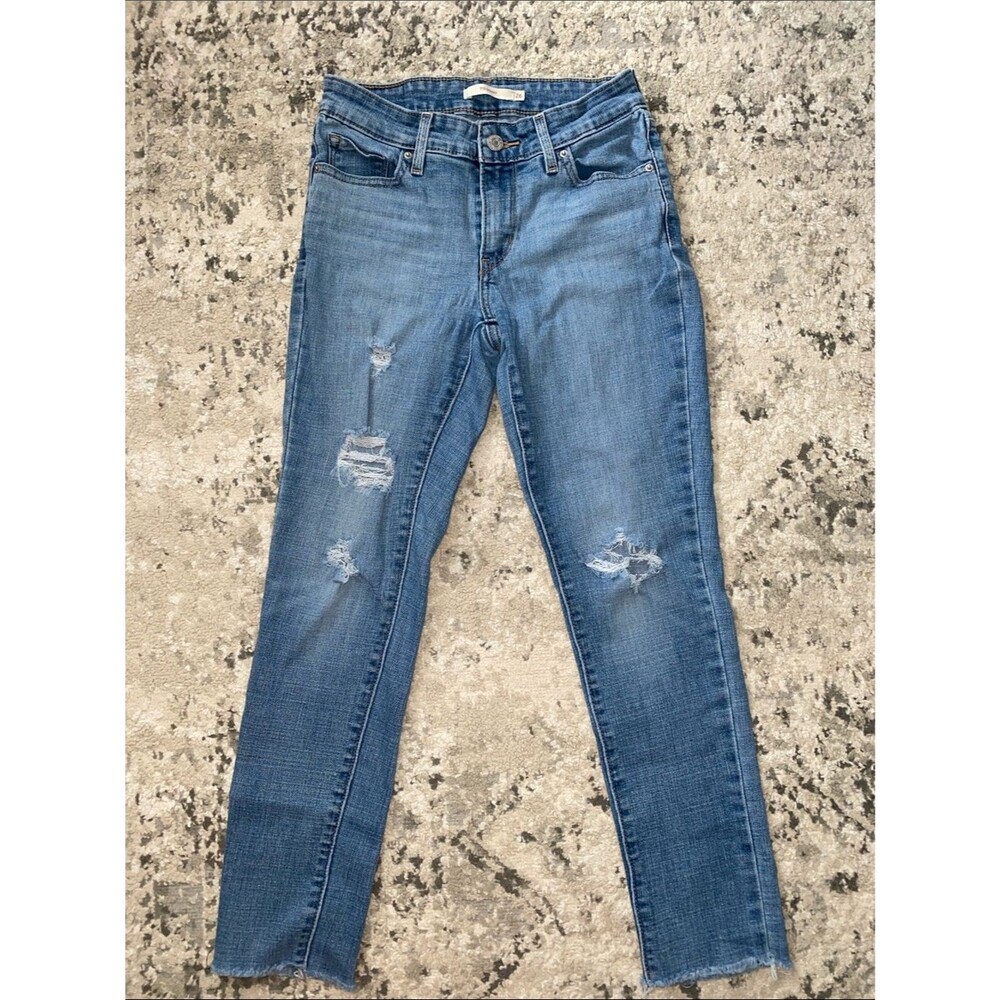Levi's Women's 711 Skinny Jeans in Medium Blue with Distressed Knees